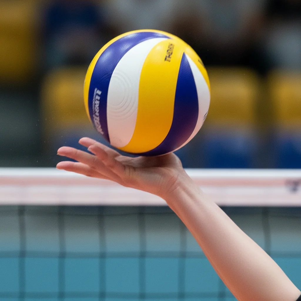 Close-up of female volleyball player's hand during powerful spike contact.