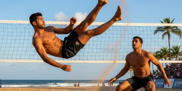 Dynamic footvolley action with a player performing a bicycle kick on a sandy court.