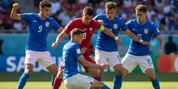 US soccer players executing a high press against an opponent, showing coordinated defensive effort.